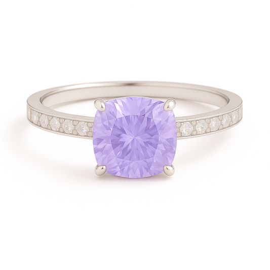 7mm cushion-cut Purple Sapphire ring with Moissanite accents in white-gold-plated 925 silver. Finely crafted and hypoallergenic. Available now at BSI Jewelry.