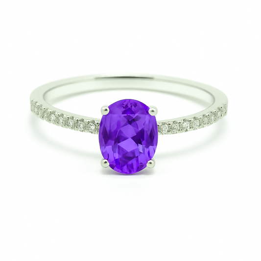 Radiant 7×5 mm purple sapphire oval engagement ring accented with Moissanite, in white gold-plated 925 silver and palladium alloy. Available now at BSI Jewelry.