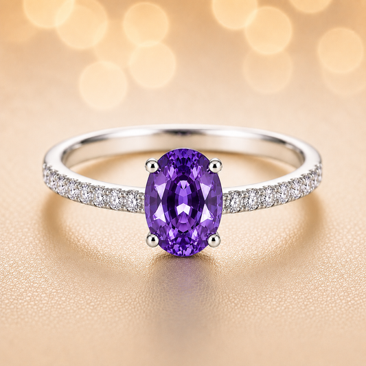 Radiant 7×5 mm purple sapphire oval engagement ring accented with Moissanite, in white gold-plated 925 silver and palladium alloy. Available now at BSI Jewelry.