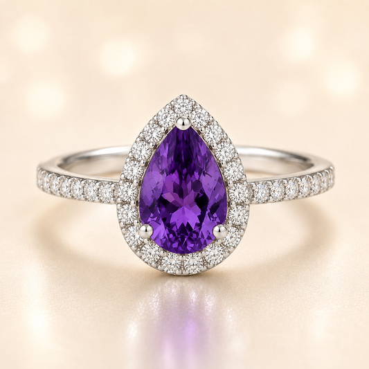 7×5 mm pear-cut purple sapphire ring with Moissanite halo in white-gold-plated 925 silver. Majestic color and timeless elegance. Available now at BSI Jewelry.