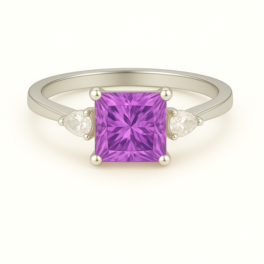6 mm princess-cut purple sapphire ring with Moissanite accents in white-gold-plated 925 silver. Radiant sparkle and timeless elegance. Available at BSI Jewelry.
