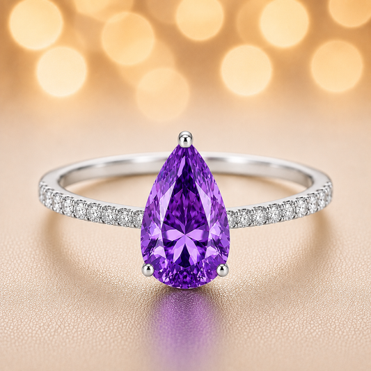 7×5 mm pear purple sapphire ring with Moissanite on white gold-plated 925 silver. Elegant, radiant, and hypoallergenic. Available now at BSI Jewelry.