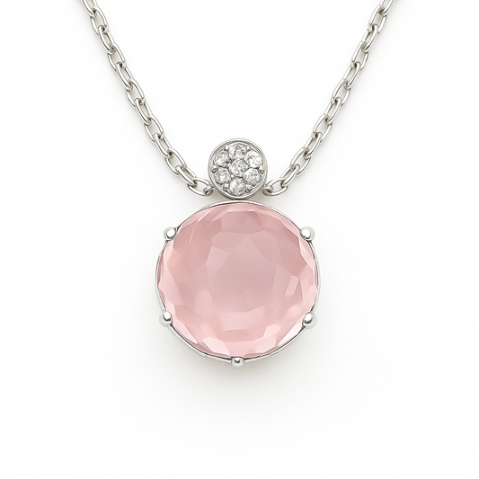 Soft rose quartz cabochon pendant accented with Moissanite in 925 silver. 9 mm gem, hypoallergenic design and timeless feminine charm. Available at BSI Jewelry.