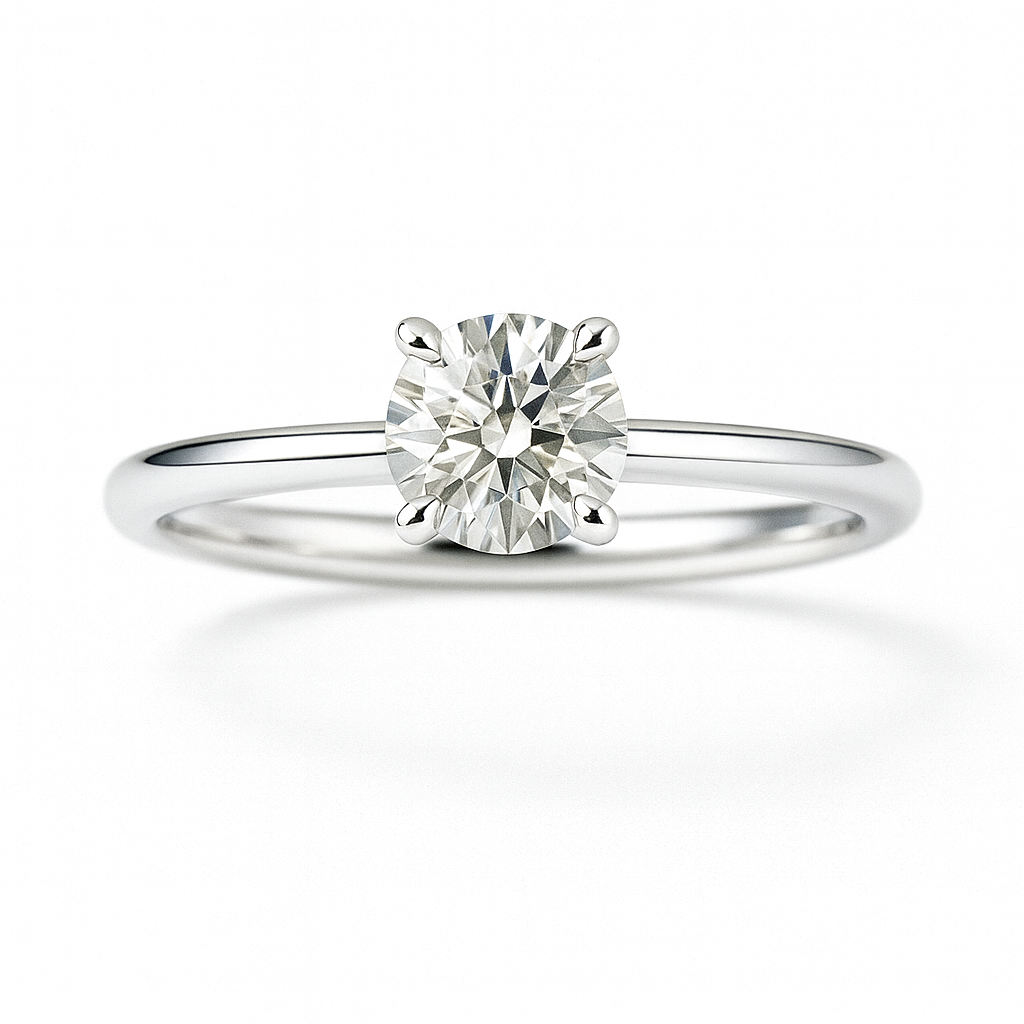 0.10 carat round moissanite solitaire ring in white gold-plated 925 silver. Brilliant sparkle and refined elegance for any occasion. Available now at BSI Jewelry.