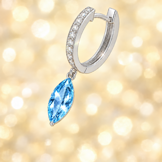 Sky blue topaz huggie earrings, 8x4 mm marquise cut in white gold-plated 925 silver with Moissanite. Elegant and hypoallergenic. Available now at BSI Jewelry.