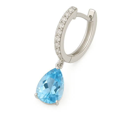 Moissanite & Sky Blue Topaz Huggie Earrings, 8×5 mm pear cut, crafted in white gold-plated 925 silver. Elegant and hypoallergenic. Available now at BSI Jewelry.
