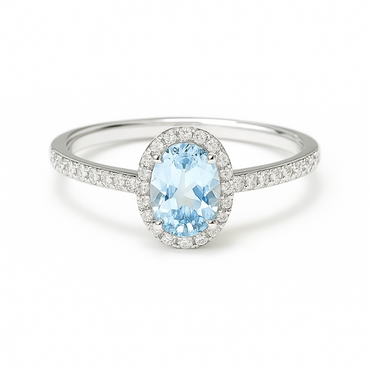 Elegant sky blue topaz halo ring in white gold-plated 925 silver, accented with Moissanite for radiant brilliance. Hypoallergenic. Available now at BSI Jewelry.