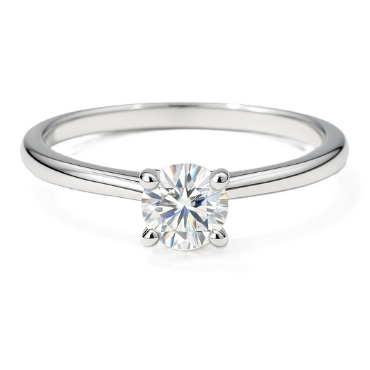 Moissanite solitaire ring with 3 mm round stone, crafted in white-gold-plated 925 silver. Timeless sparkle and refined elegance. Available now at BSI Jewelry.