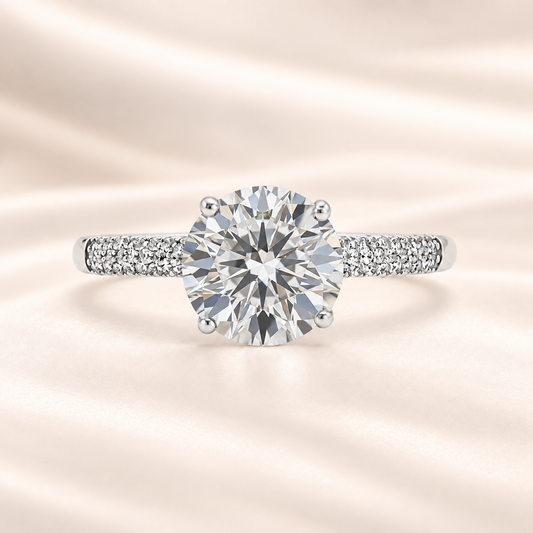 Brilliant Moissanite solitaire ring with 8 mm round stone in white gold-plated 925 silver. Radiant sparkle and hypoallergenic comfort. Available at BSI Jewelry.