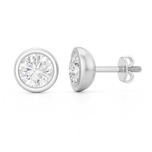 Moissanite stud earrings with 4.5 mm round stones in sleek bezel setting, crafted in white gold-plated 925 silver. Modern and elegant. Available at BSI Jewelry.