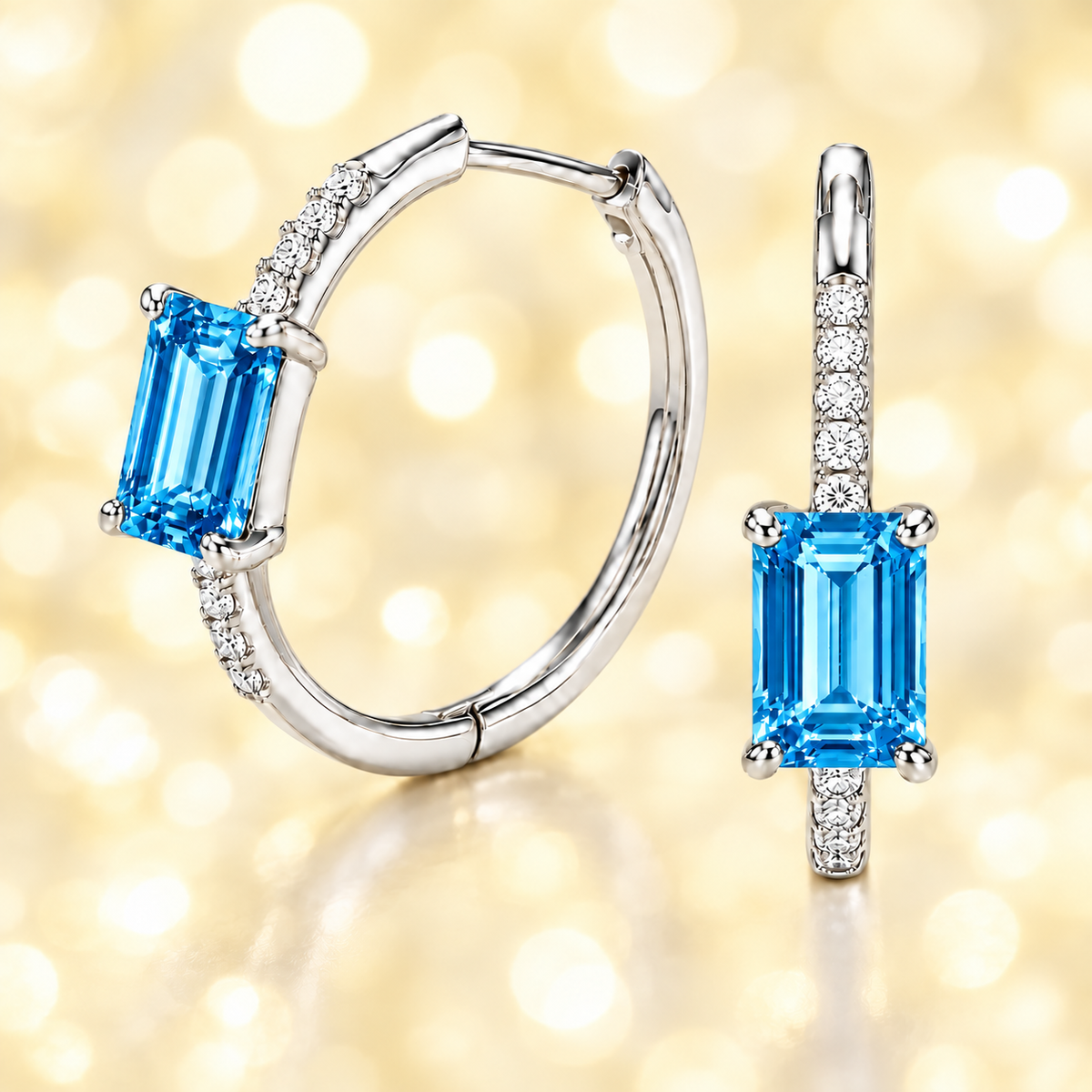 Bright swiss blue topaz and Moissanite huggie earrings with 6×4 mm emerald-cut stones in white gold-plated 925 silver. Hypoallergenic comfort. Now at BSI Jewelry.