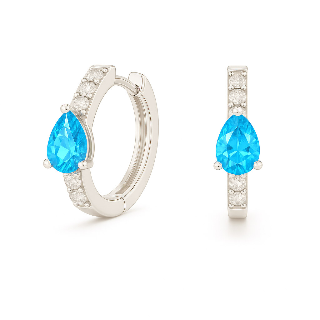 Elegant pear-cut Swiss blue topaz huggie in white gold-plated 925 silver with Moissanite accents for fresh, versatile sparkle. Available now at BSI Jewelry.