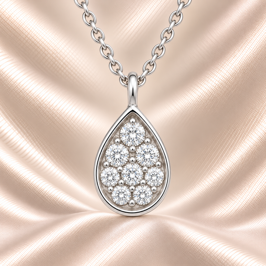 Radiant Moissanite teardrop pendant in 925 silver with pavé brilliance and refined finish. Hypoallergenic and elegant for daily wear. Available at BSI Jewelry.