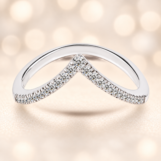 A graceful 0.10 carat Moissanite V-shaped half-eternity wedding band, crafted in white-gold-plated 925 silver for a timelessly elegant and versatile design.