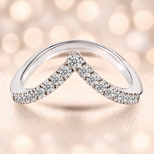 A graceful V-shaped wedding band with 17 Moissanite stones totaling 0.70 carat, crafted in white-gold-plated 925 silver for refined sparkle and timeless beauty.