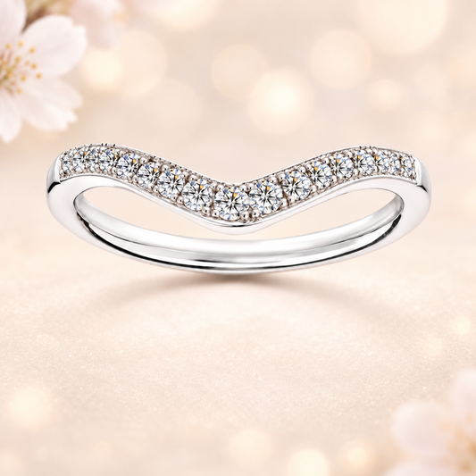Moissanite V-shaped wedding band in white-gold-plated 925 silver with delicate milgrain frame for vintage charm and refined style. Available now at BSI Jewelry.