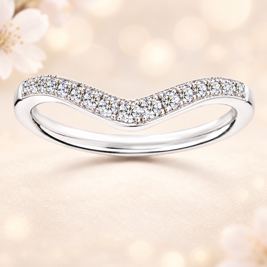 Moissanite V-shaped wedding band in white-gold-plated 925 silver with milgrain frame for vintage charm and refined sparkle. Available now at BSI Jewelry.