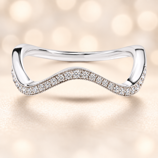 A sleek wave-shaped wedding band featuring 23 Moissanite stones totaling 0.10 carat, crafted in white-gold-plated 925 silver for a modern and elegant sparkle.