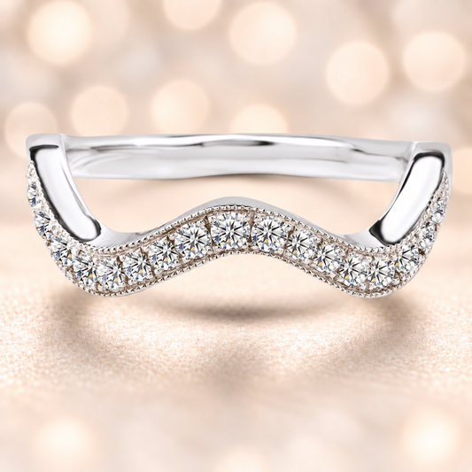 A luminous wave-shaped wedding band with 19 Moissanite stones totaling 0.50 carat, crafted in white-gold-plated 925 silver for radiant, timeless elegance.