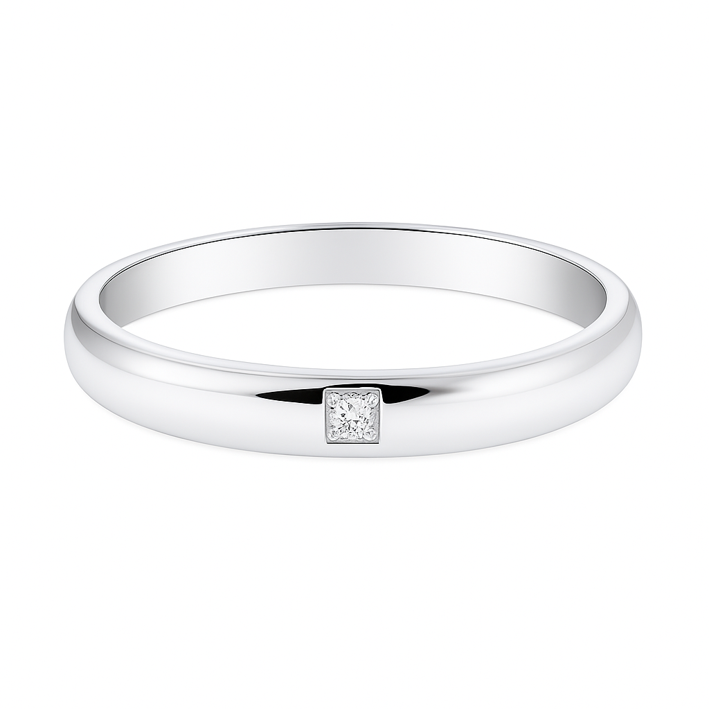 Elegant 2.5 mm Moissanite wedding band with a single round brilliant, crafted in white gold-plated 925 silver and palladium alloy. Available now at BSI Jewelry.