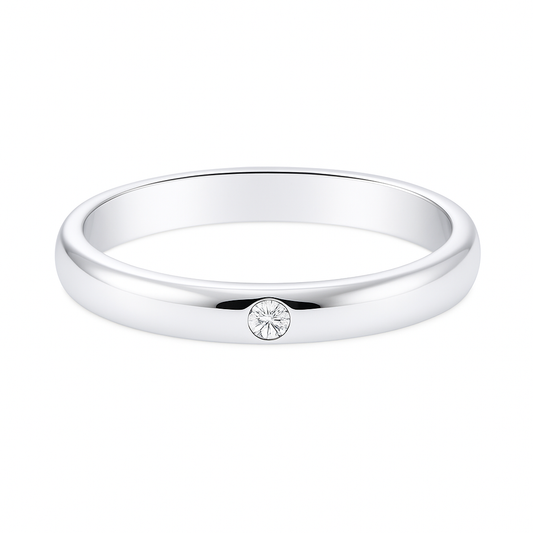 Moissanite wedding band with one round brilliant stone in 2.50 mm width. White-gold-plated 925 silver, hypoallergenic and elegant. Available now at BSI Jewelry.