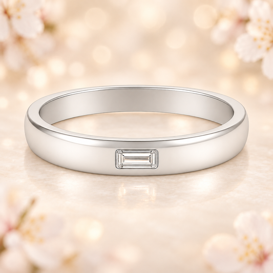 Elegant Moissanite wedding band with 4×2mm baguette-cut stones in white gold-plated 925 silver and palladium alloy. A symbol of grace. Available at BSI Jewelry.