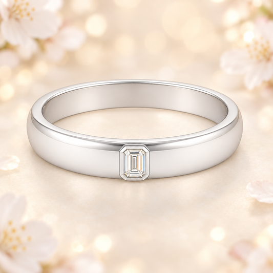 Moissanite wedding band with 4×2 mm emerald-cut stones in white gold-plated 925 silver with palladium alloy. Radiant and Elegant. Available now at BSI Jewelry.