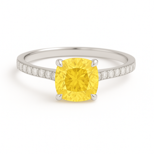 Elegant 7mm cushion yellow sapphire ring accented with Moissanite, crafted in white gold-plated 925 silver with palladium alloy. Available now at BSI Jewelry.