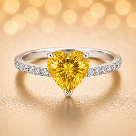 6mm heart-cut Yellow Sapphire ring with Moissanite accents in white-gold-plated 925 silver. Elegant, timeless, and hypoallergenic. Available now at BSI Jewelry.