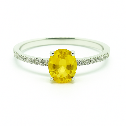Elegant yellow sapphire engagement ring in white gold-plated 925 silver, accented with Moissanite. Brilliant and hypoallergenic. Available now at BSI Jewelry.