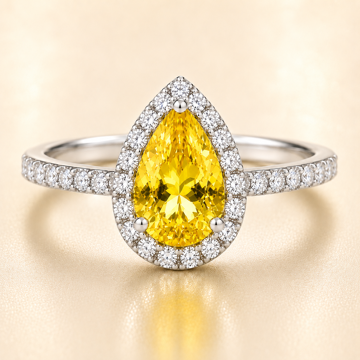7×5 mm pear-cut yellow sapphire ring with Moissanite halo in white-gold-plated 925 silver. Radiant golden glow and timeless elegance. Available at BSI Jewelry.