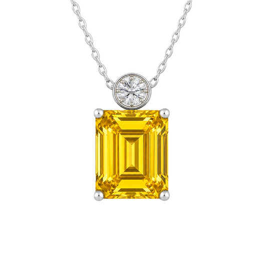 Yellow sapphire & Moissanite pendant with 7×5 emerald-cut stone in white gold-plated 925 silver. Vibrant sparkle and hypoallergenic comfort. Now at BSI Jewelry.