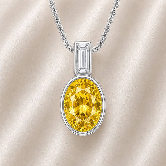 Elegant 7×5 mm Yellow Sapphire pendant in white-gold-plated 925 silver, highlighted with a Moissanite accent for refined sparkle. Available now at BSI Jewelry.