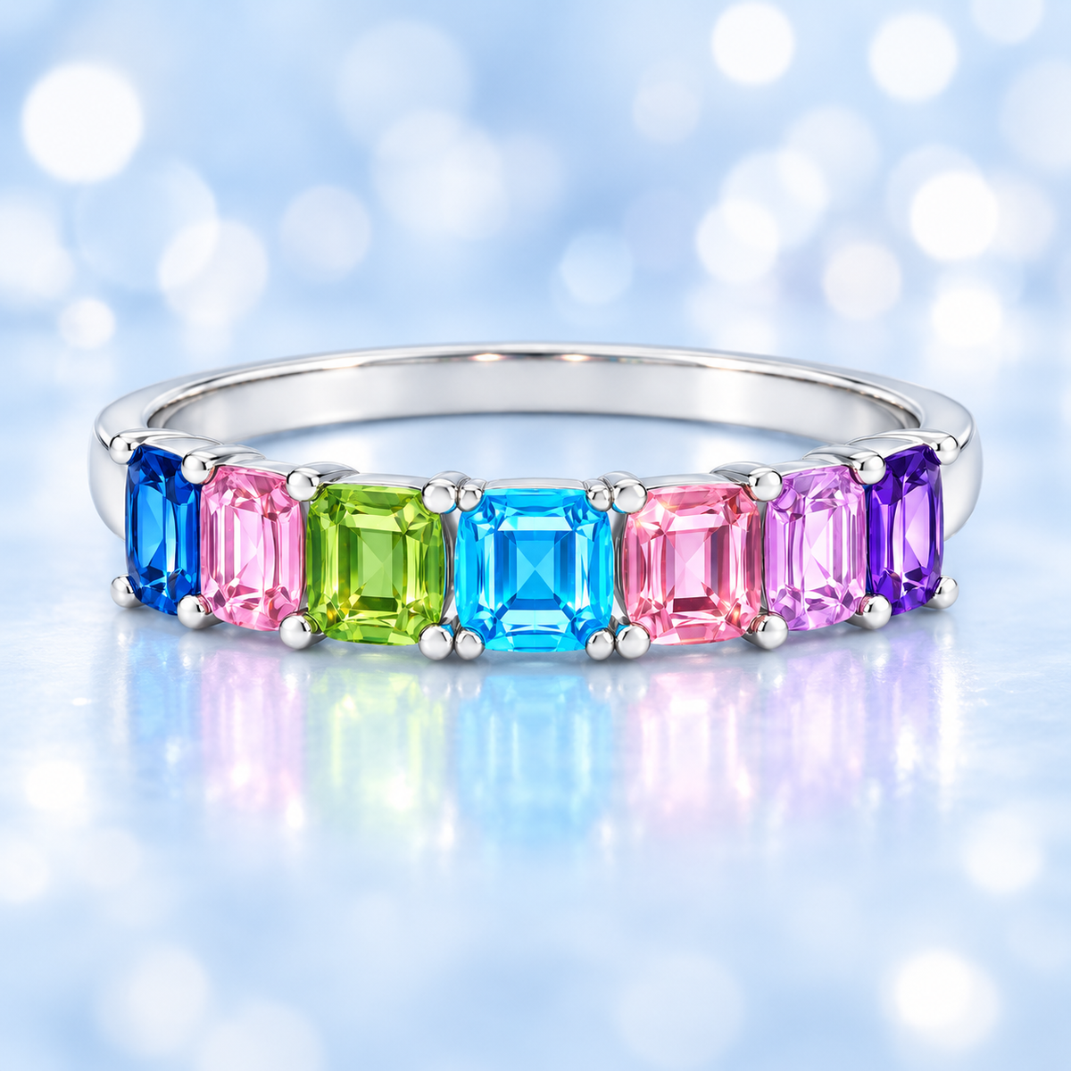 Multi-color gemstone ring with seven 3 mm Asscher-cut stones in white gold-plated 925 silver, creating a refined rainbow look. Shop BSI Jewelry.