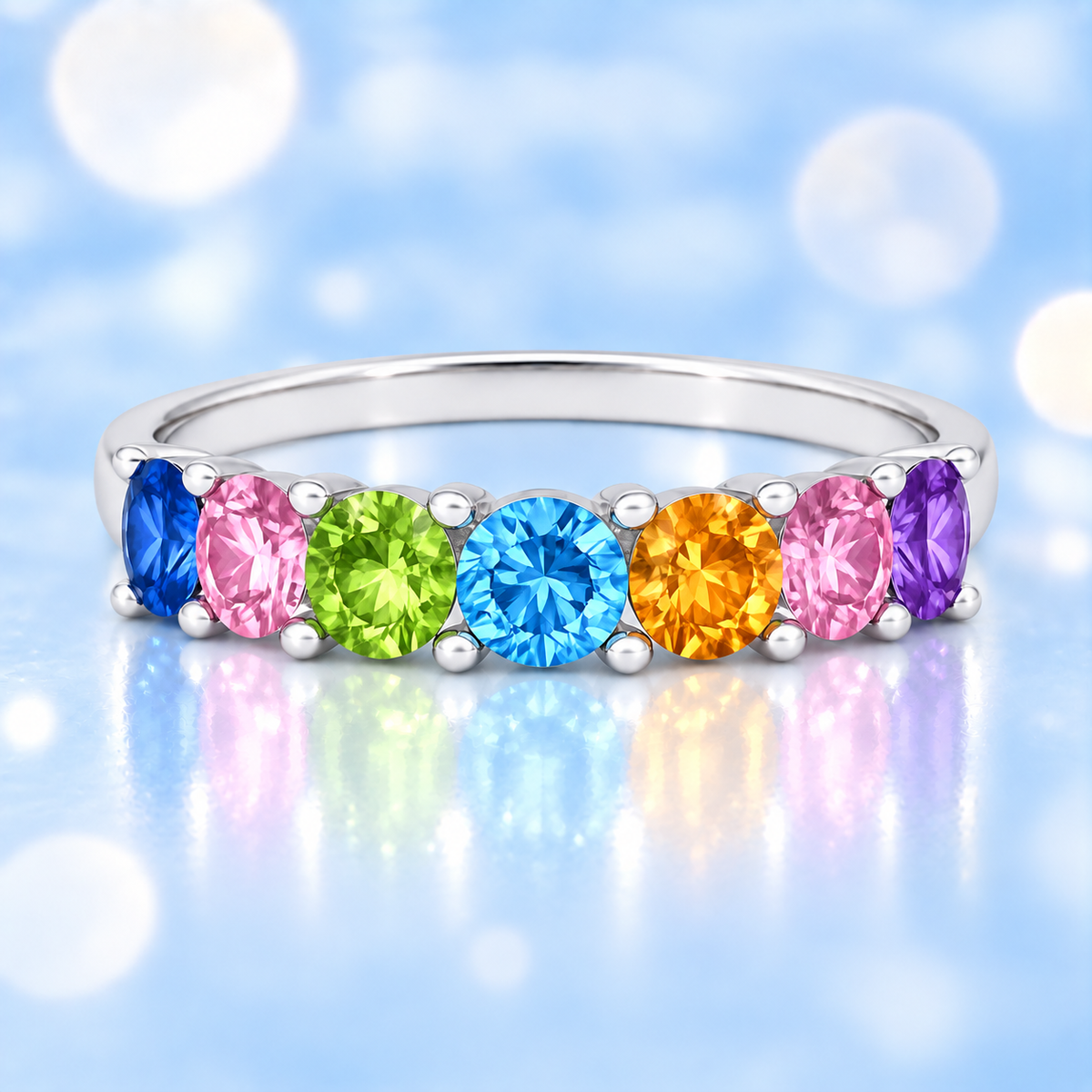 Multi-color gemstone ring with seven 3 mm round-cut stones in white gold-plated 925 silver, creating a refined rainbow look. Shop BSI Jewelry.