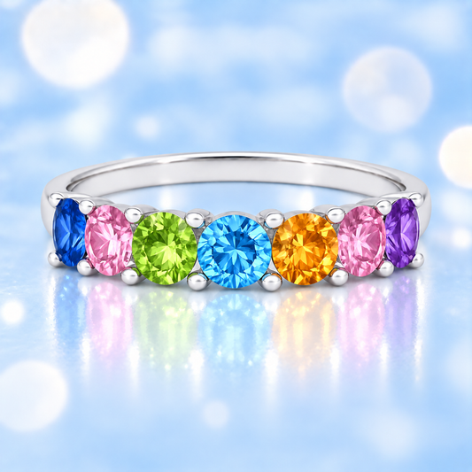 Multi-color gemstone ring with seven 3 mm round-cut stones in white gold-plated 925 silver, creating a refined rainbow look. Shop BSI Jewelry.