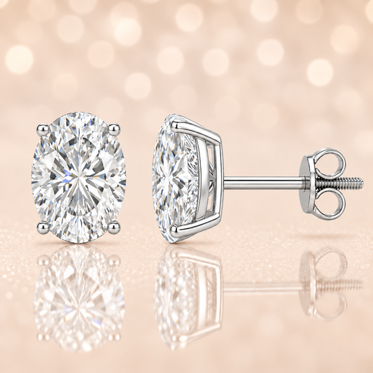 Oval moissanite stud earrings, 9×7 mm oval in white gold-plated 925 silver with screw-back posts. Elegant sparkle for daily wear. Available now at BSI Jewelry.