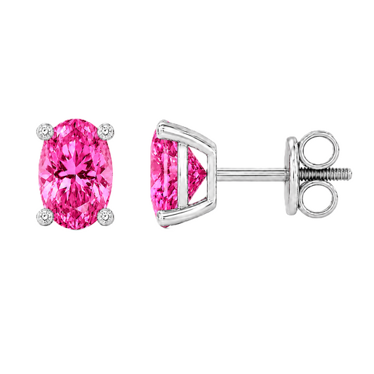 Oval pink sapphire stud earrings with 6×4 mm oval stones and moissanite prongs in white gold plated 925 silver. Available now at BSI Jewelry.