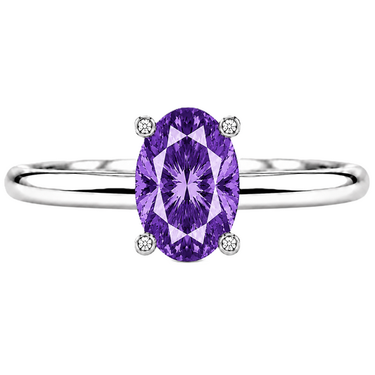Purple sapphire engagement ring featuring a 6×4 mm oval gemstone in white gold-plated 925 silver. Mystic and hypoallergenic. Available now at BSI Jewelry.