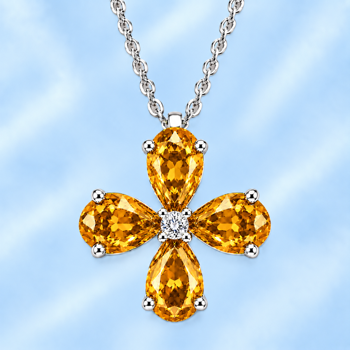 Pear citrine flower pendant featuring four 5×4 mm pear gemstones in white gold-plated 925 silver with moissanite accent, available now at BSI Jewelry.