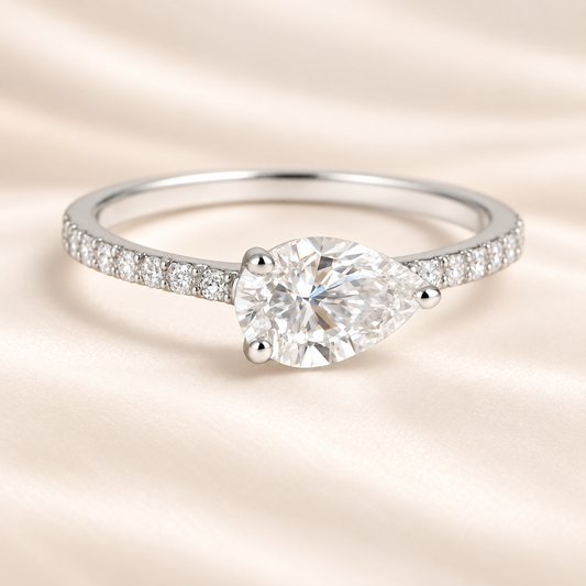 Fall in love with this 7×5mm Pear Moissanite Engagement Ring in White Gold Plated 925 Silver. GRA Certified, hypoallergenic, and finely crafted by BSI Jewelry.