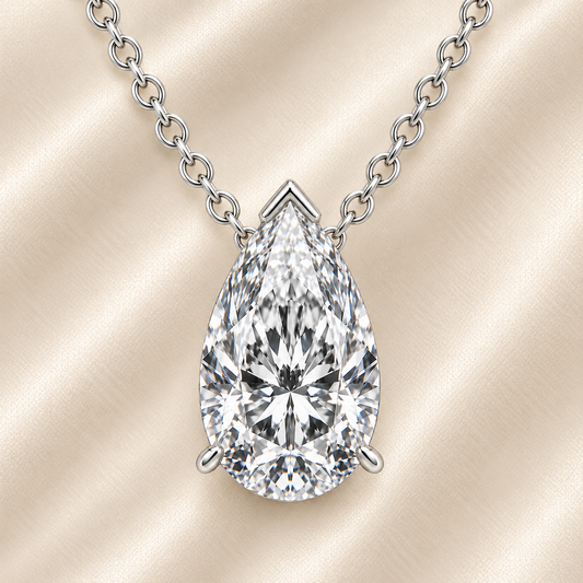 Pear moissanite necklace, 10×7 mm pear, set in white gold-plated 925 silver. Brilliant sparkle, elegant and timeless for daily wear. Available now at BSI Jewelry.