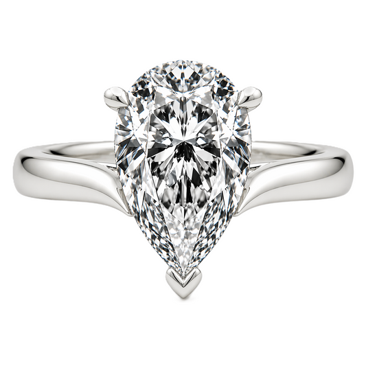 Pear cut moissanite ring, 10×7 mm, set in white gold plated 925 silver. Elegant brilliance with a bold, refined design. Available now at BSI Jewelry.