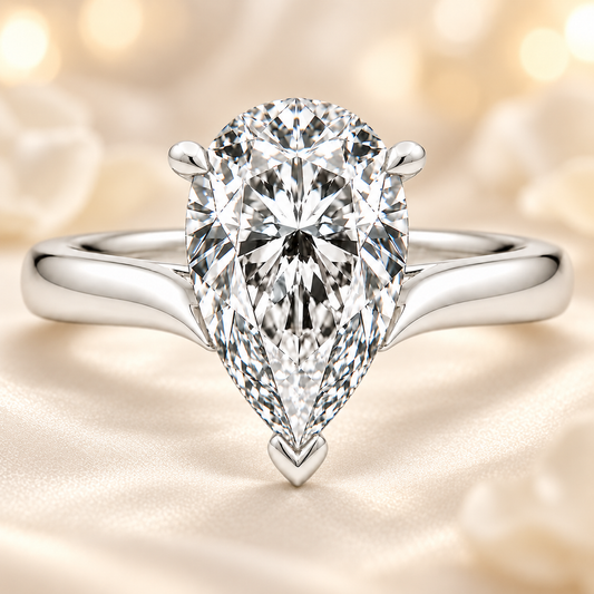Pear cut moissanite ring, 10×7 mm, set in white gold plated 925 silver. Elegant brilliance with a bold, refined design. Available now at BSI Jewelry.