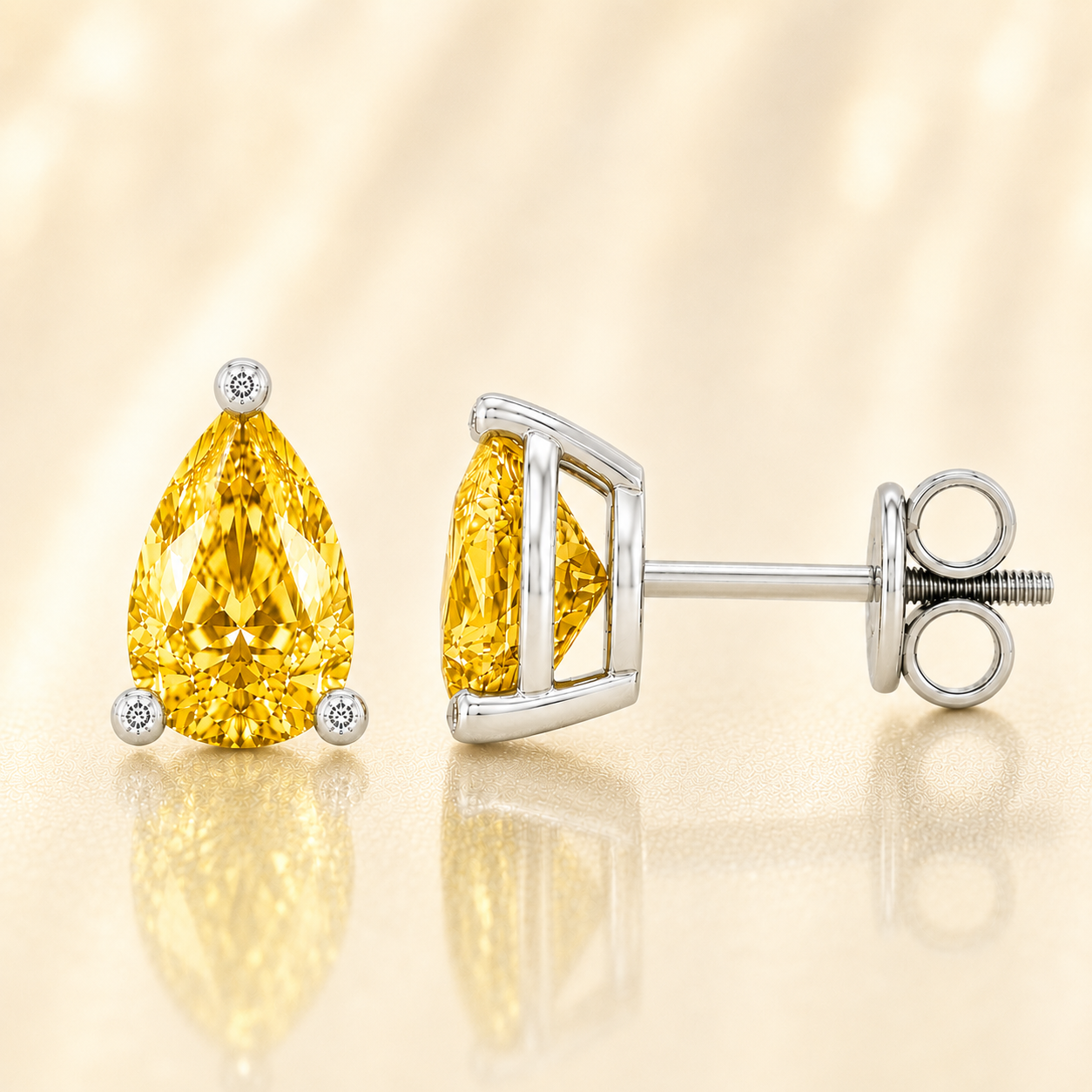 Pear yellow sapphire stud earrings with 6×4 mm stones and moissanite prongs in white gold plated 925 silver. Available now at BSI Jewelry.