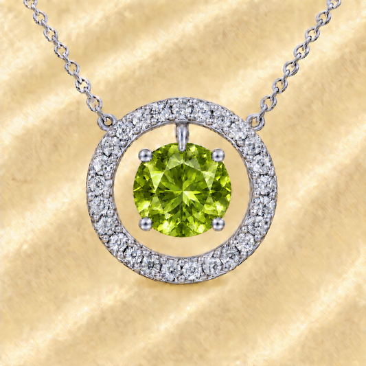 Peridot necklace with a 6 mm round gemstone and moissanite halo in white gold-plated 925 silver. Elegant and radiant. Available now at BSI Jewelry.