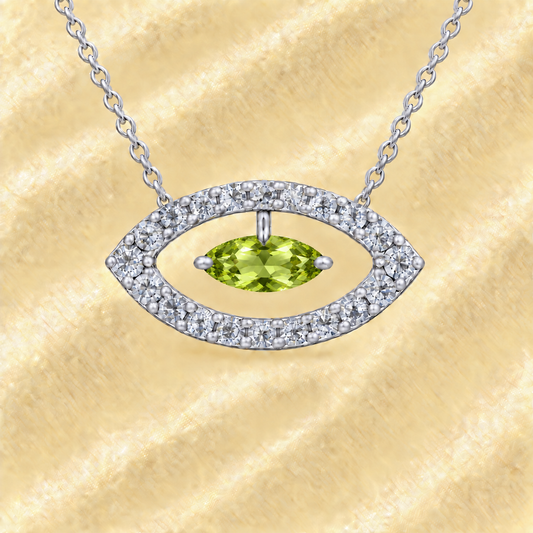 Peridot necklace with a 7×3.5 mm marquise-cut stone in white gold-plated 925 silver, accented with moissanite. Available now at BSI Jewelry.