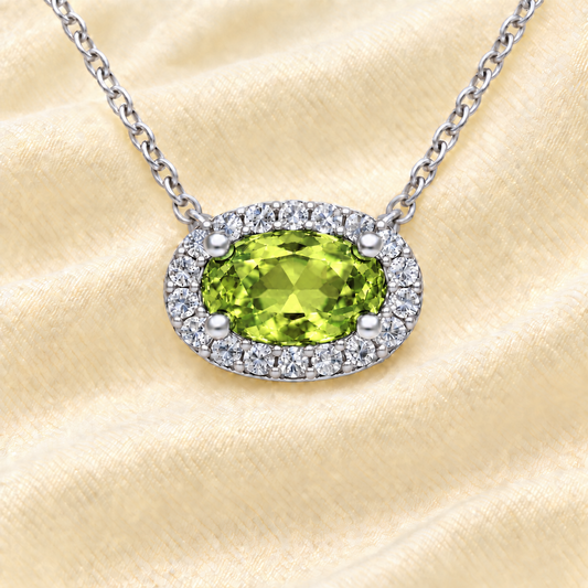 Peridot necklace with a 7×4 mm oval in white gold-plated 925 silver, with moissanite. Elegant and refined for daily wear. Available now at BSI Jewelry.