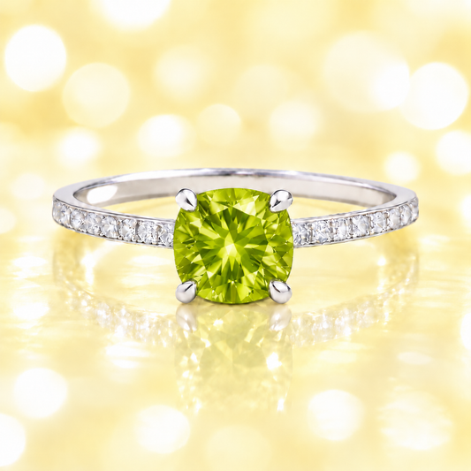 Peridot ring with a 6 mm cushion in white gold-plated 925 silver, accented with moissanite. Fresh and elegant for daily wear. Available now at BSI Jewelry.