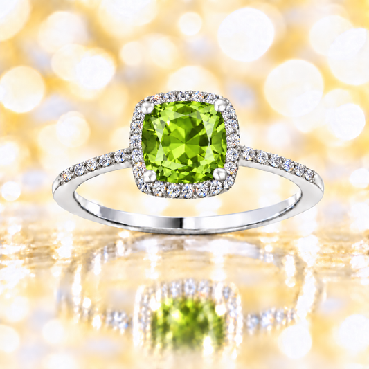 Peridot ring with a 6 mm cushion-cut center in white gold-plated 925 silver, accented with moissanite for refined sparkle. Available now at BSI Jewelry.